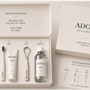 ADORA Complete Oral Care Kit — open box with floss picks, toothbrush, toothpaste, tongue scraper and mouthwash